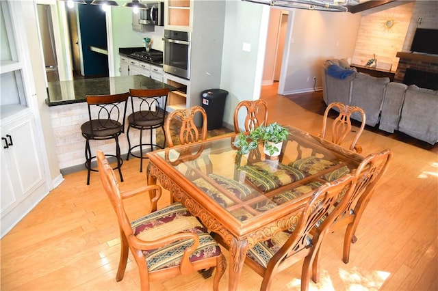 dining room with light hardwood / wood-style floors