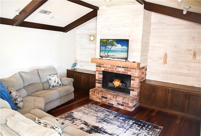 living room with dark hardwood / wood-style flooring, wood walls, and lofted ceiling with beams