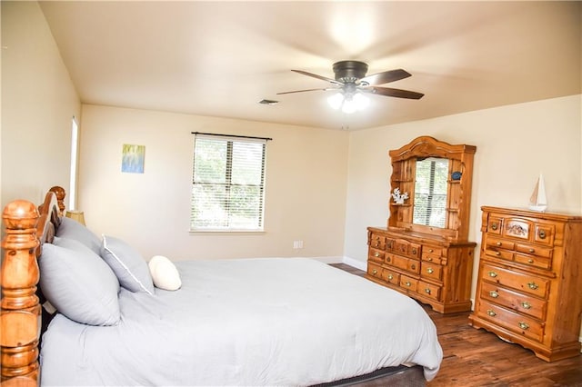 bedroom featuring ceiling fan and dark hardwood / wood-style floors