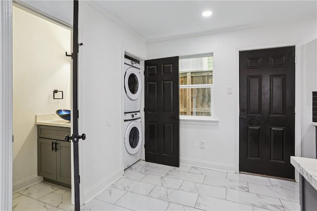 washroom with stacked washer and dryer