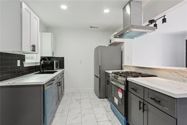 kitchen with island exhaust hood, stainless steel appliances, sink, white cabinets, and gray cabinets