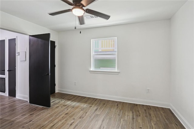 unfurnished bedroom with ceiling fan and light hardwood / wood-style flooring