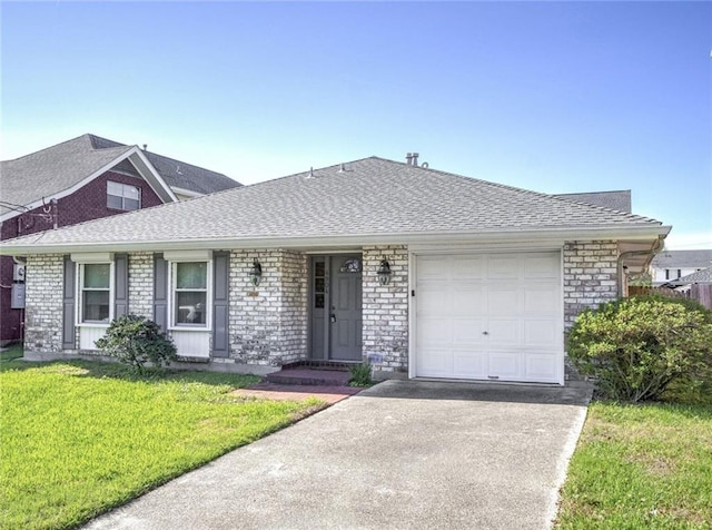 single story home with a garage and a front lawn