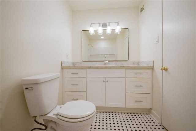 bathroom with toilet and vanity