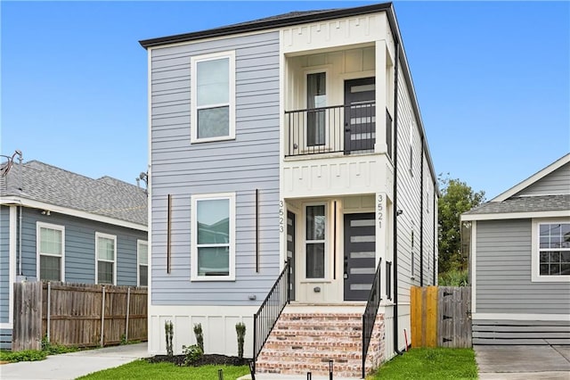 view of front of house with a balcony