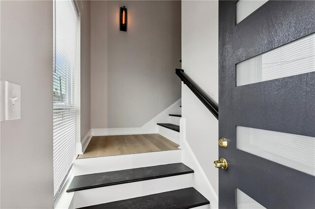 stairway featuring hardwood / wood-style flooring