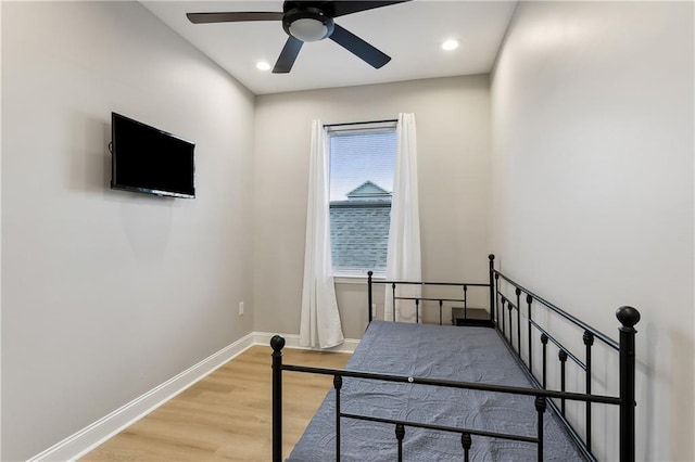 bedroom with light wood-type flooring and ceiling fan