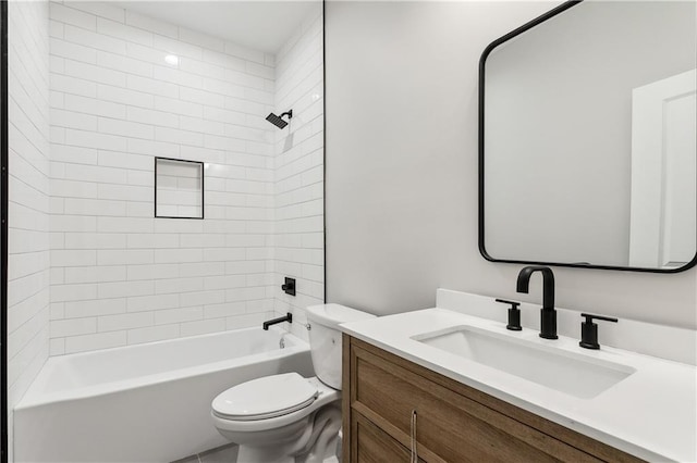 full bathroom featuring vanity, toilet, and tiled shower / bath