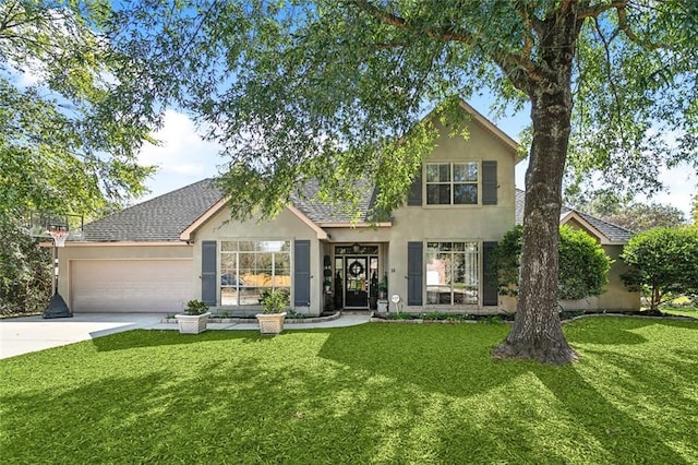 view of front of house with a front yard and a garage