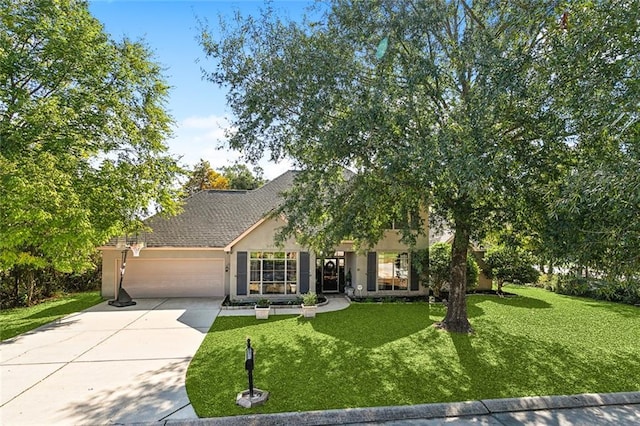 view of front facade featuring a garage and a front lawn