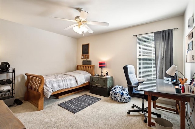 bedroom with light colored carpet and ceiling fan