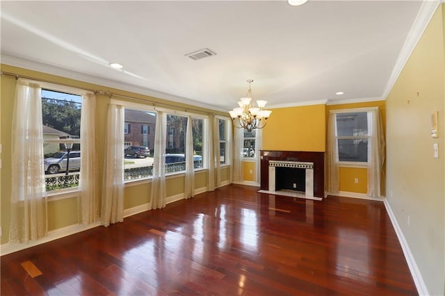 unfurnished living room featuring an inviting chandelier, crown molding, and dark wood-type flooring