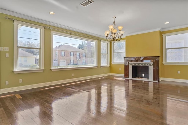 unfurnished living room featuring a fireplace, visible vents, crown molding, and wood finished floors