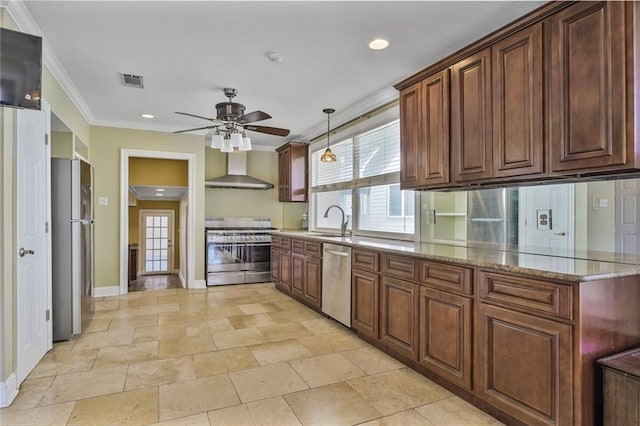 kitchen featuring visible vents, appliances with stainless steel finishes, ornamental molding, a sink, and wall chimney exhaust hood