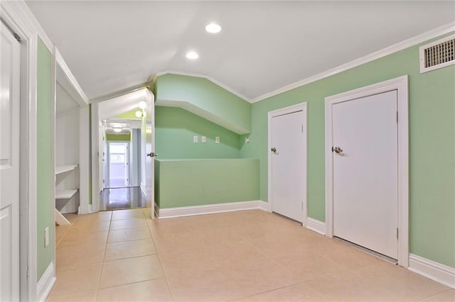 additional living space featuring lofted ceiling, recessed lighting, visible vents, tile patterned flooring, and baseboards