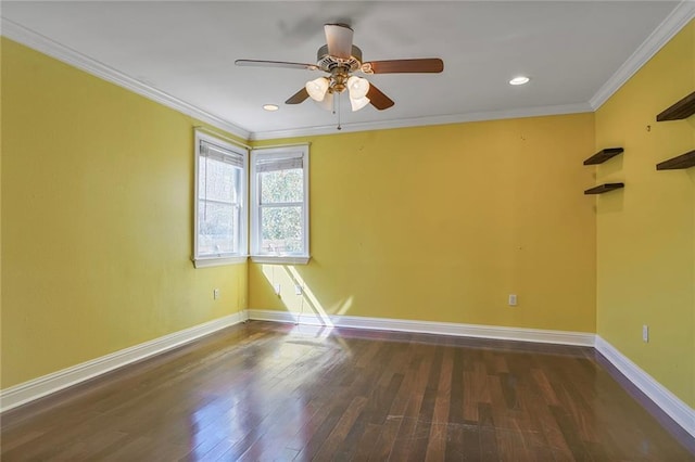 empty room with ceiling fan, ornamental molding, wood finished floors, and baseboards