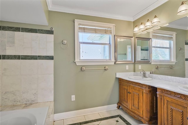 bathroom with baseboards, a tub to relax in, a sink, and crown molding