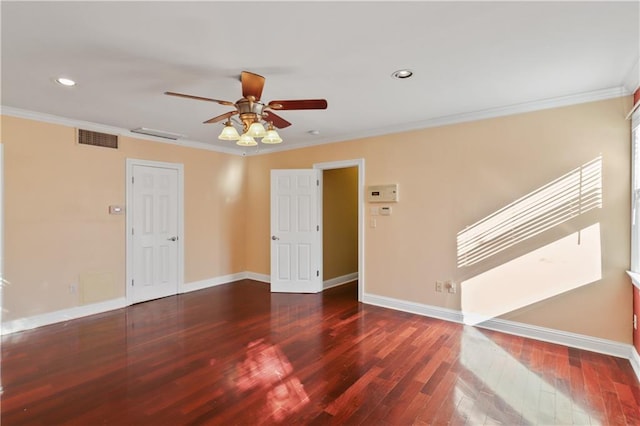 empty room featuring ceiling fan, ornamental molding, and dark hardwood / wood-style flooring