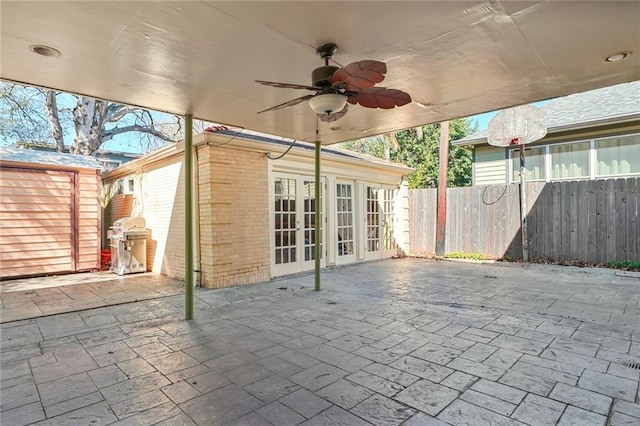 view of patio featuring a ceiling fan, french doors, and fence