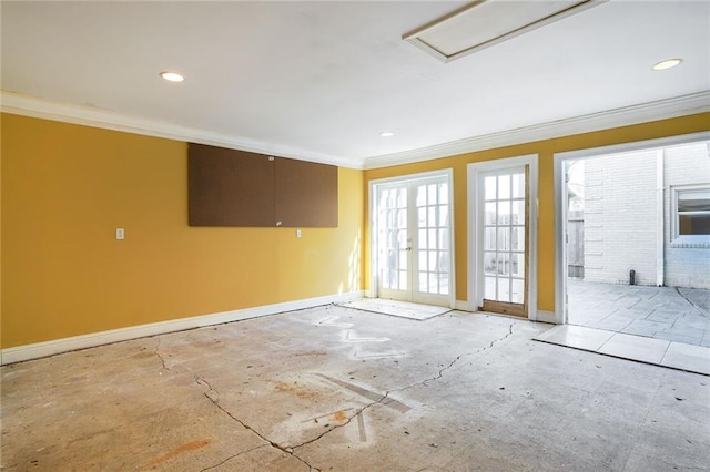 empty room featuring recessed lighting, baseboards, ornamental molding, and french doors