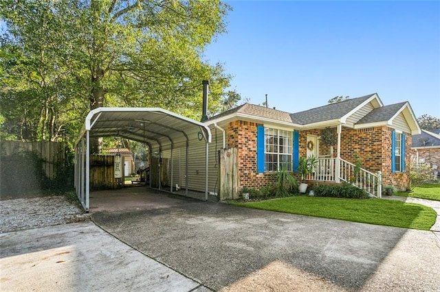 exterior space with a carport and a front yard