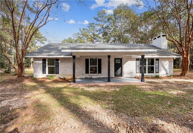 single story home featuring a patio and a front lawn