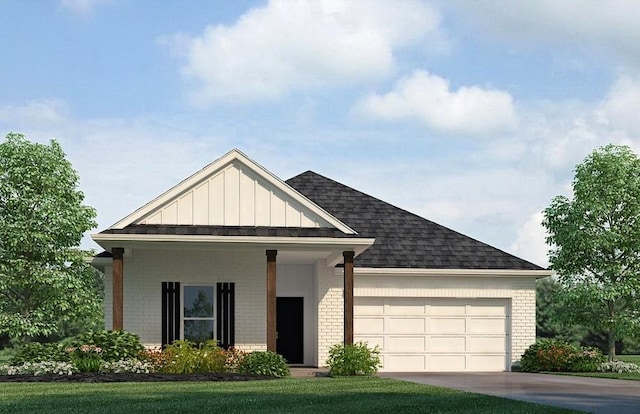 24279 Gadwall Ave, Ponchatoula, LA 70454 - view of front of property with brick siding, a garage, roof with shingles, board and batten siding, and concrete driveway