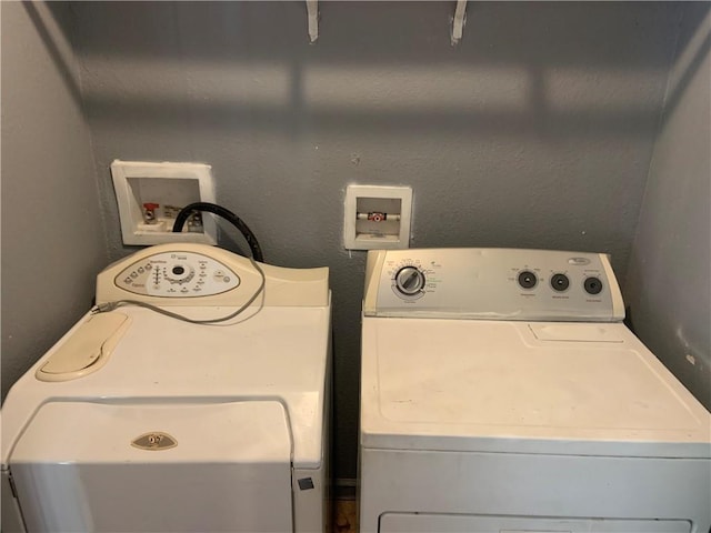 laundry room featuring independent washer and dryer