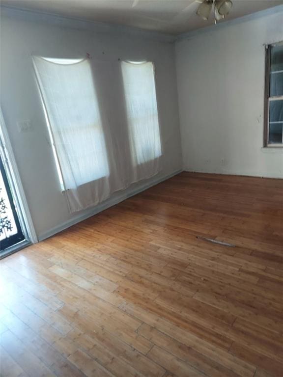 spare room featuring ceiling fan and hardwood / wood-style flooring