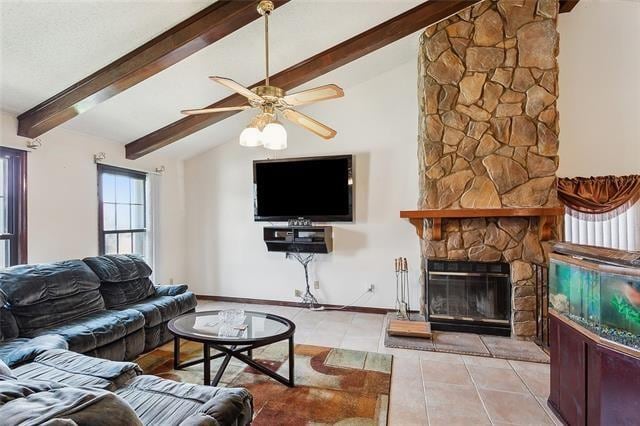 tiled living room with lofted ceiling with beams, a stone fireplace, and ceiling fan