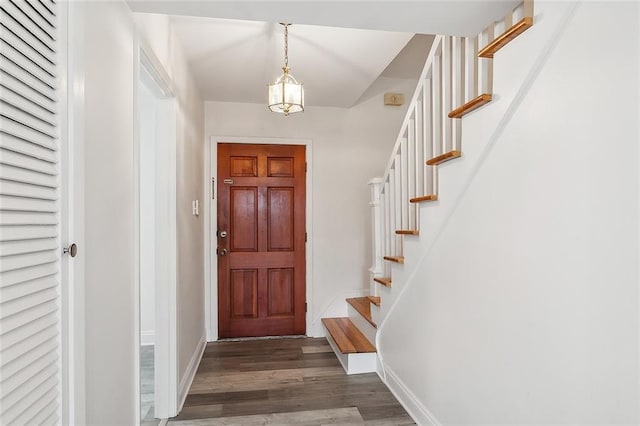 foyer with dark hardwood / wood-style floors