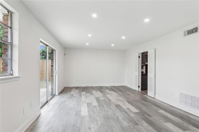 unfurnished room with light hardwood / wood-style flooring