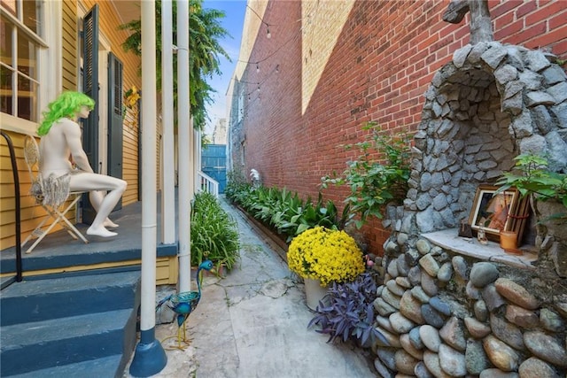 820B Saint Ann St, New Orleans, LA 70116 - view of property exterior featuring brick siding