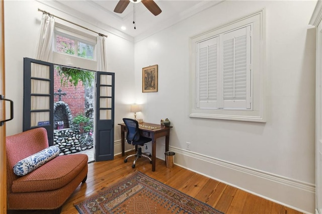 home office with ceiling fan, wood-type flooring, and crown molding