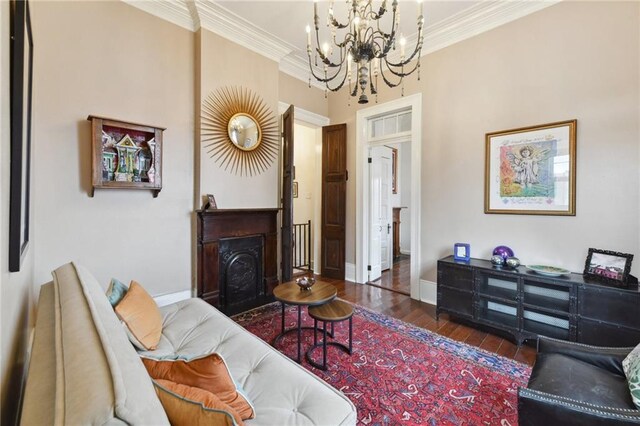 820B Saint Ann St, New Orleans, LA 70116 - living room with a chandelier, wood finished floors, ornamental molding, and baseboards