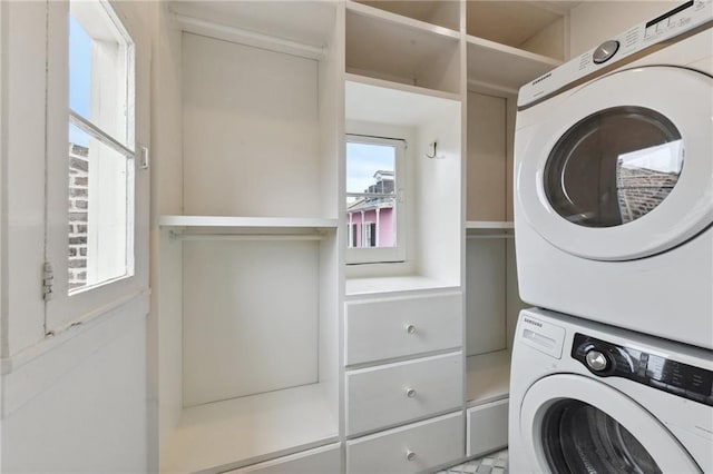 clothes washing area with stacked washer / drying machine