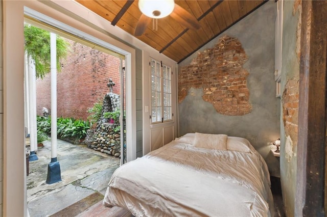 bedroom featuring multiple windows, wood ceiling, vaulted ceiling, and access to exterior