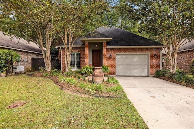 single story home featuring a garage and a front yard