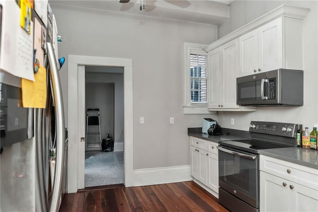 kitchen featuring dark hardwood / wood-style flooring, white cabinets, ceiling fan, and stainless steel appliances