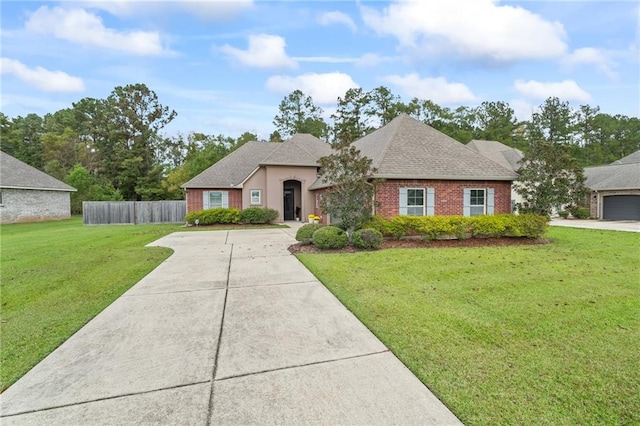 ranch-style house with a front yard and a garage