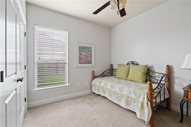 bedroom with ceiling fan and light colored carpet