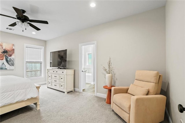 carpeted bedroom with ceiling fan and connected bathroom