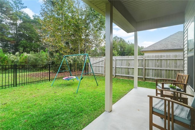 exterior space with a playground and a patio area