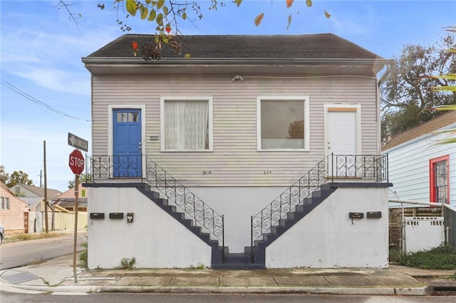 639 Independence St, New Orleans, LA 70117 - view of front facade with roof with shingles
