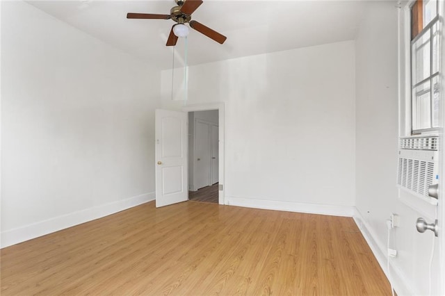 spare room featuring light wood-type flooring and ceiling fan