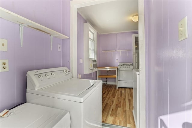 639 Independence St, New Orleans, LA 70117 - laundry area with washer / dryer and wood finished floors