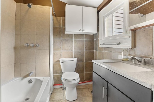 639 Independence St, New Orleans, LA 70117 - full bathroom with vanity, tile walls, shower / washtub combination, and tile patterned flooring