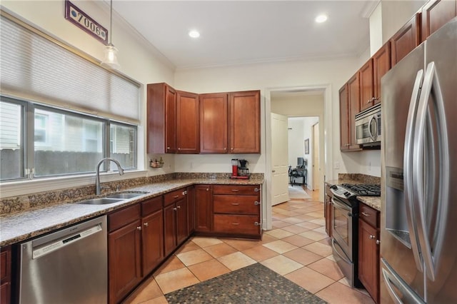 kitchen featuring stainless steel appliances, hanging light fixtures, sink, and crown molding