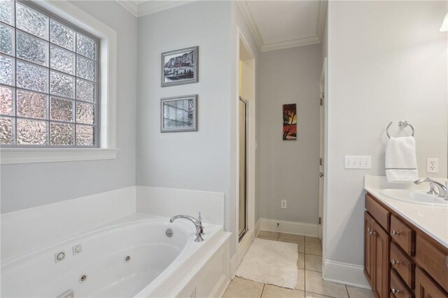 bathroom featuring ornamental molding, vanity, tile patterned floors, and plus walk in shower