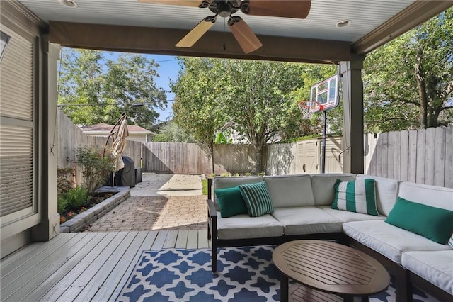 wooden terrace with outdoor lounge area and ceiling fan